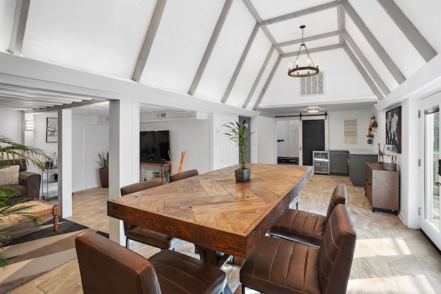 dining area with wine cooler, beam ceiling, a barn door, high vaulted ceiling, and a notable chandelier