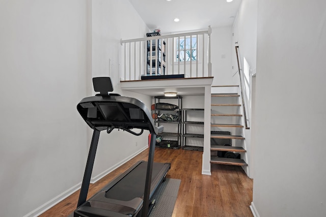 exercise room featuring hardwood / wood-style floors