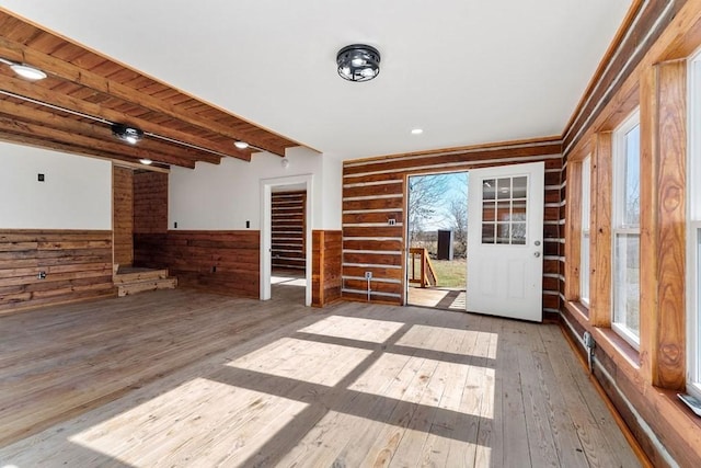 interior space featuring wood ceiling, a wealth of natural light, and beamed ceiling