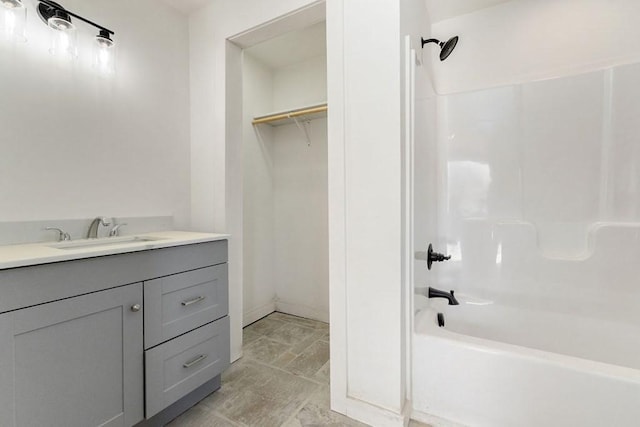 bathroom with vanity and  shower combination