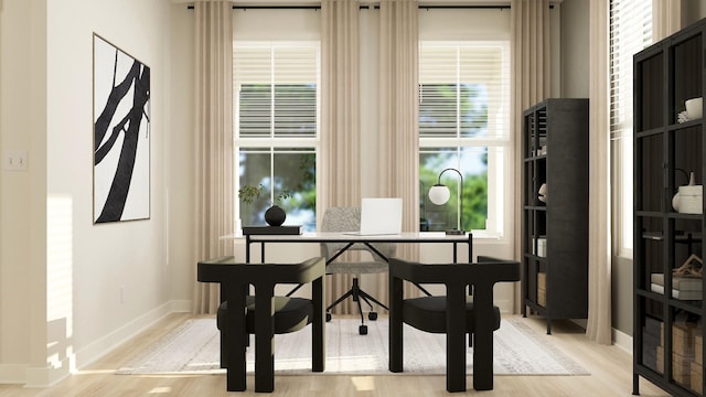 dining space with light hardwood / wood-style floors