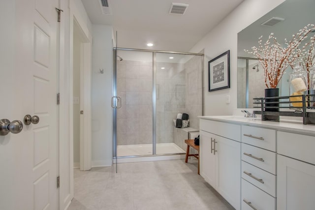 bathroom featuring an enclosed shower and vanity