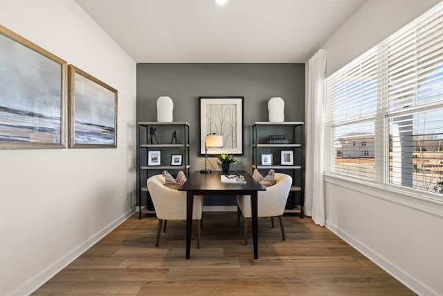 dining space with hardwood / wood-style flooring