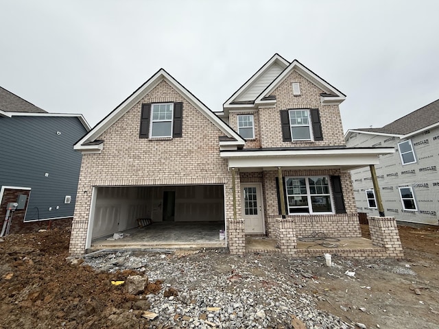 view of front of property with a garage and covered porch