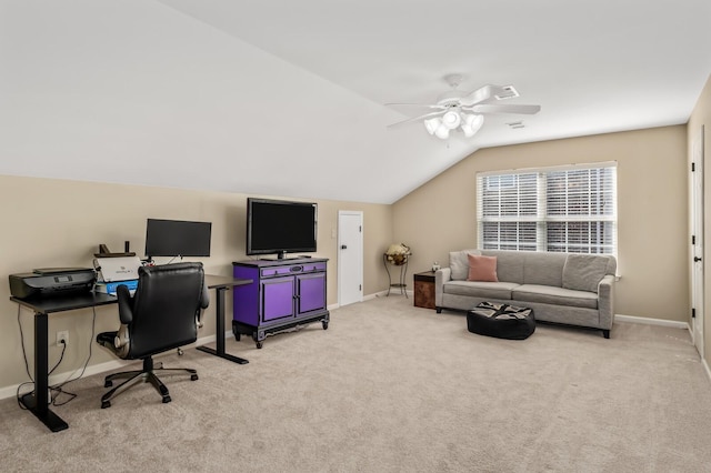 home office featuring ceiling fan, lofted ceiling, and light colored carpet