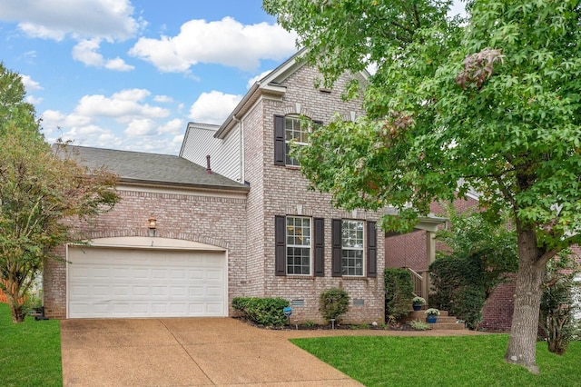 front of property with a garage and a front yard