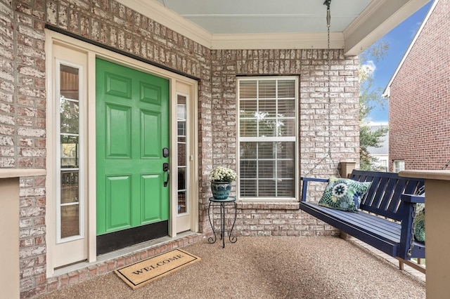 doorway to property with a porch