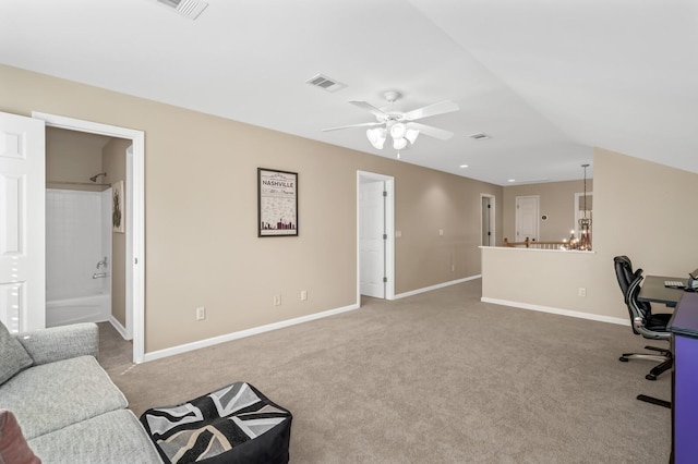 carpeted office space with lofted ceiling and ceiling fan