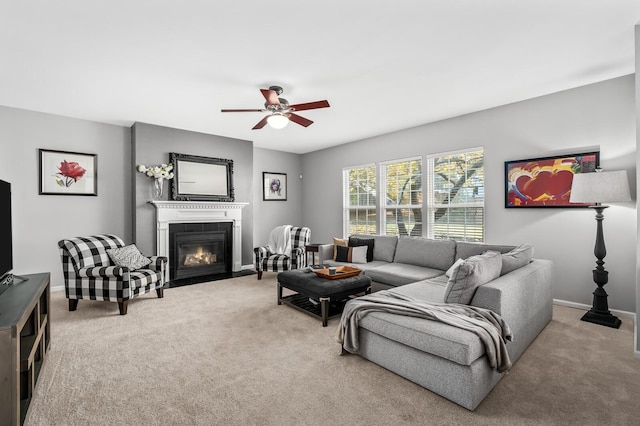 carpeted living room featuring ceiling fan