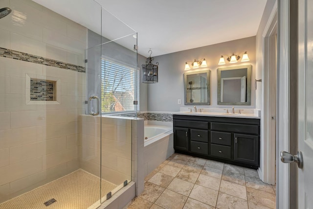 bathroom with independent shower and bath, vanity, and tile patterned flooring