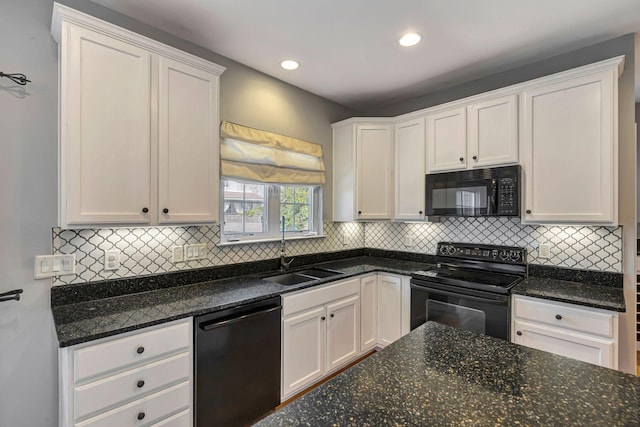 kitchen featuring sink, black appliances, and white cabinets