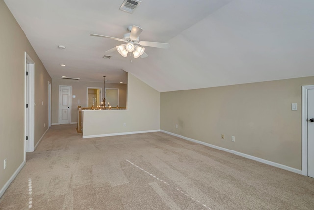 additional living space with light colored carpet, lofted ceiling, and ceiling fan with notable chandelier