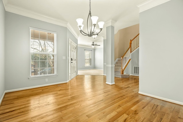 foyer entrance with stairs, ornamental molding, visible vents, and light wood-style floors