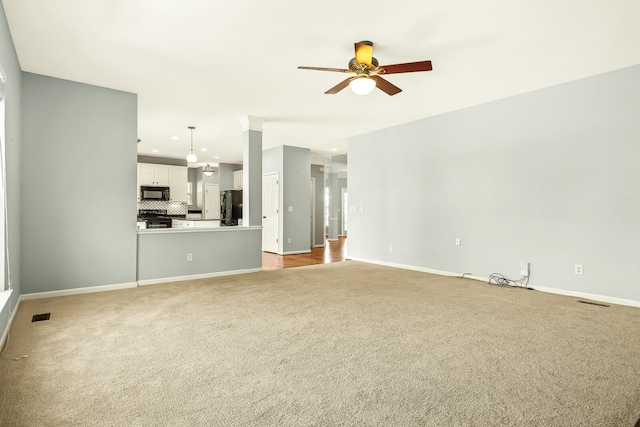 unfurnished living room featuring light carpet, visible vents, baseboards, ceiling fan, and recessed lighting