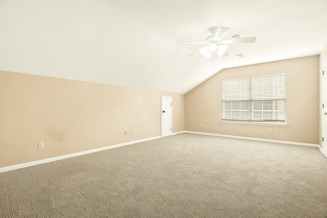 bonus room featuring a ceiling fan, carpet, vaulted ceiling, and baseboards