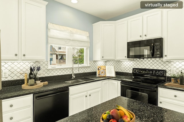 kitchen featuring black appliances, backsplash, a sink, and white cabinets