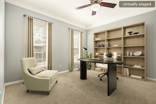 office featuring light carpet, crown molding, baseboards, and ceiling fan