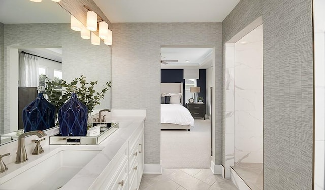 bathroom with walk in shower, ceiling fan, vanity, and tile patterned flooring