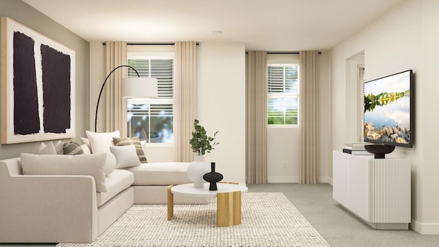 sitting room featuring light colored carpet