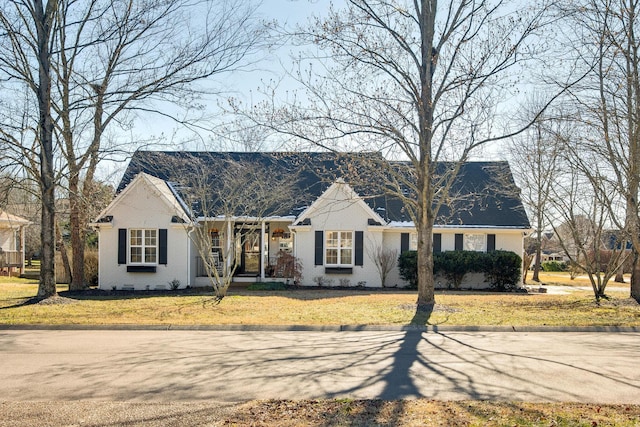 ranch-style house with a front lawn