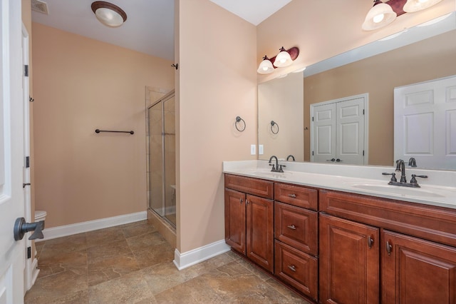 bathroom with vanity and an enclosed shower