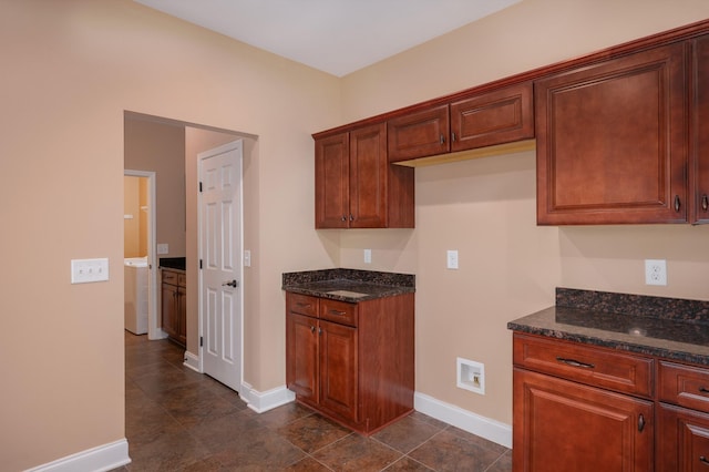 kitchen with dark stone counters