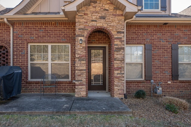 doorway to property with a patio