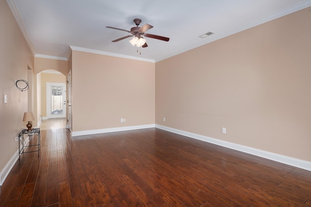 spare room with crown molding, dark hardwood / wood-style floors, and ceiling fan