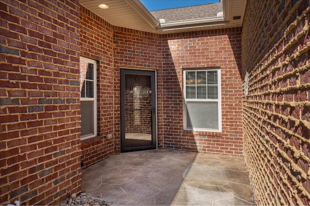 property entrance featuring a patio