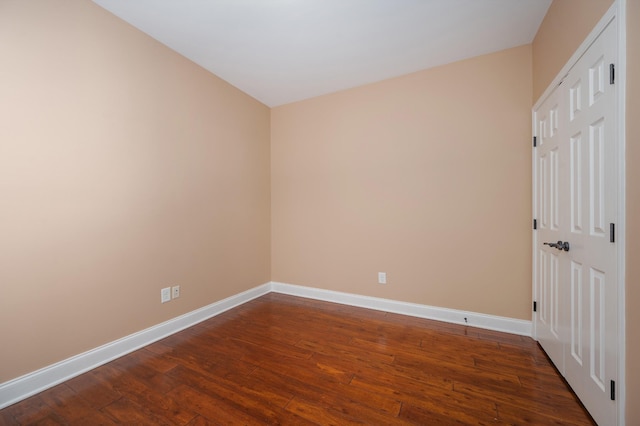 empty room featuring dark hardwood / wood-style floors