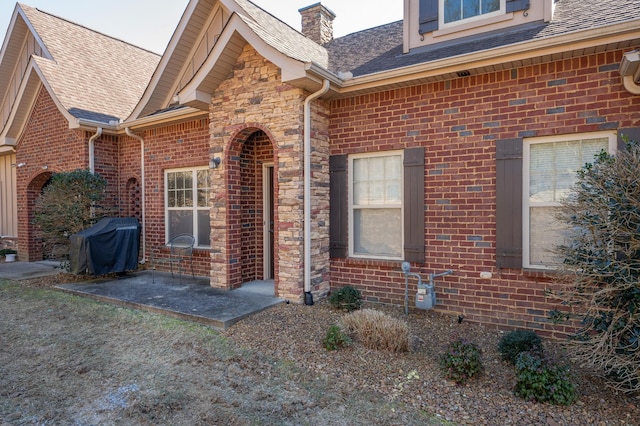 property entrance with a patio