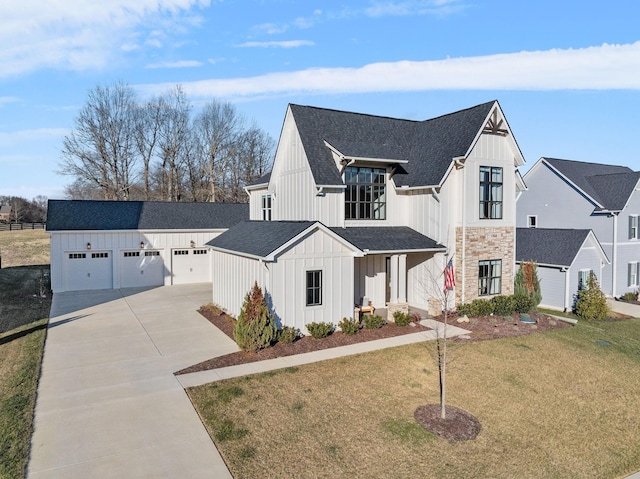 modern inspired farmhouse featuring a garage and a front yard