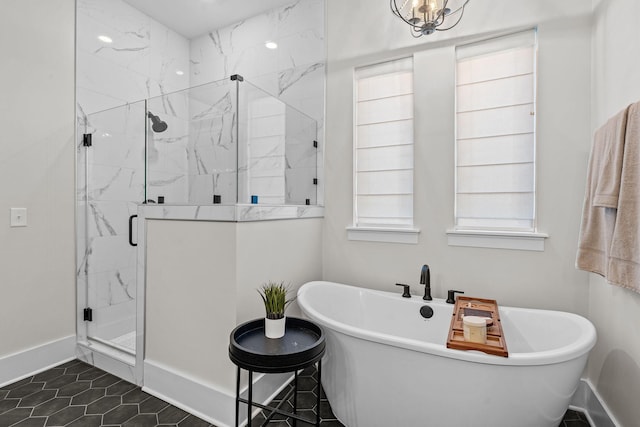 bathroom with tile patterned floors and separate shower and tub