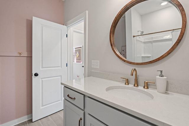 bathroom with a shower and vanity