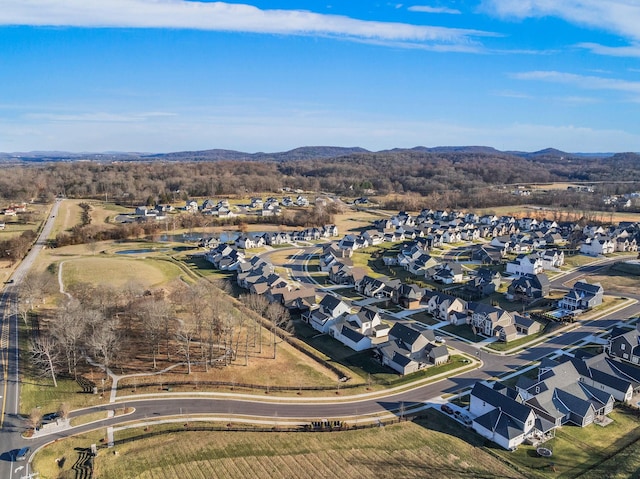 birds eye view of property with a mountain view