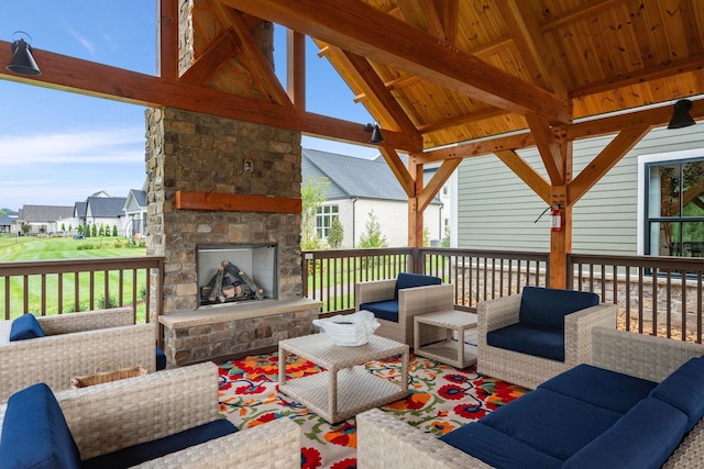 deck featuring an outdoor living space with a fireplace