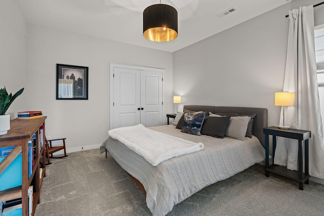 bedroom with carpet floors and a closet