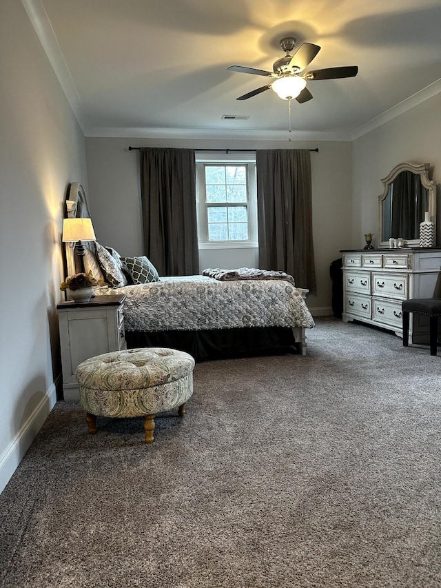 bedroom featuring ceiling fan, crown molding, and carpet floors