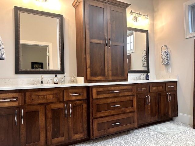 bathroom with tile patterned floors and vanity