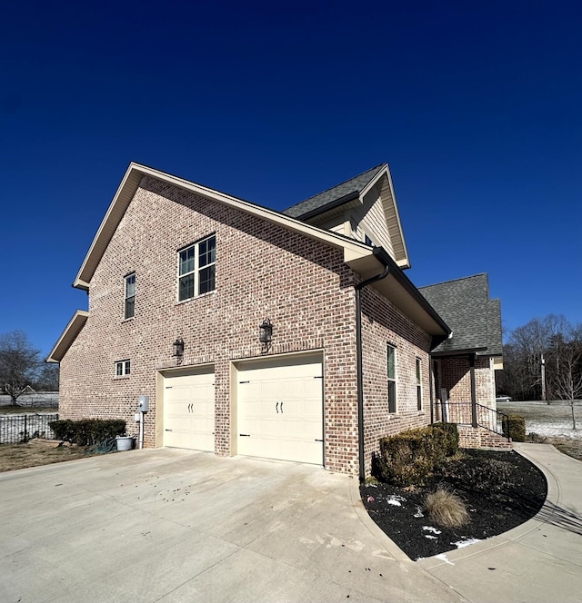 view of side of property with a garage