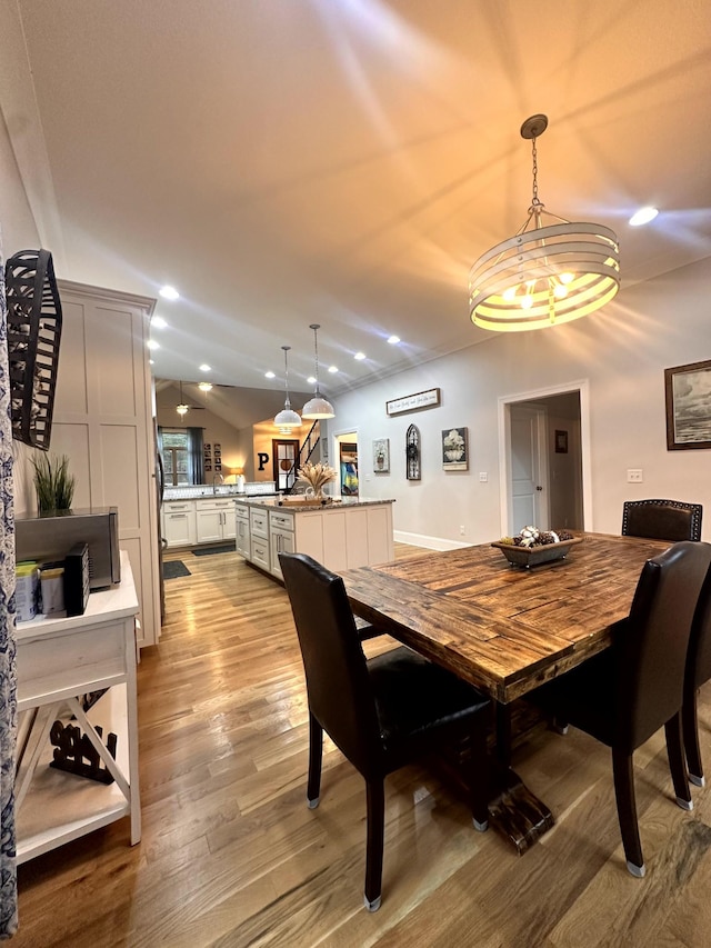 dining space featuring light hardwood / wood-style floors and sink