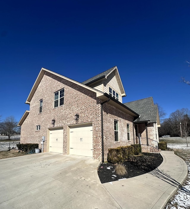 view of side of property with a garage