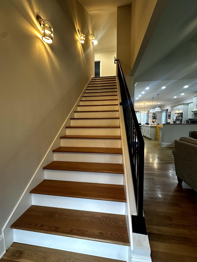 stairway featuring hardwood / wood-style flooring