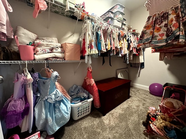 spacious closet with carpet flooring