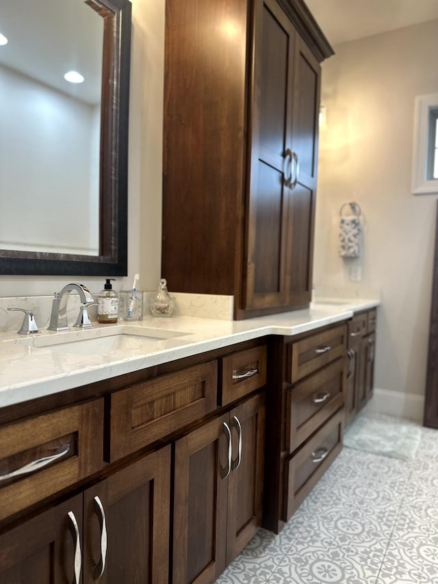 bathroom with vanity and tile patterned flooring