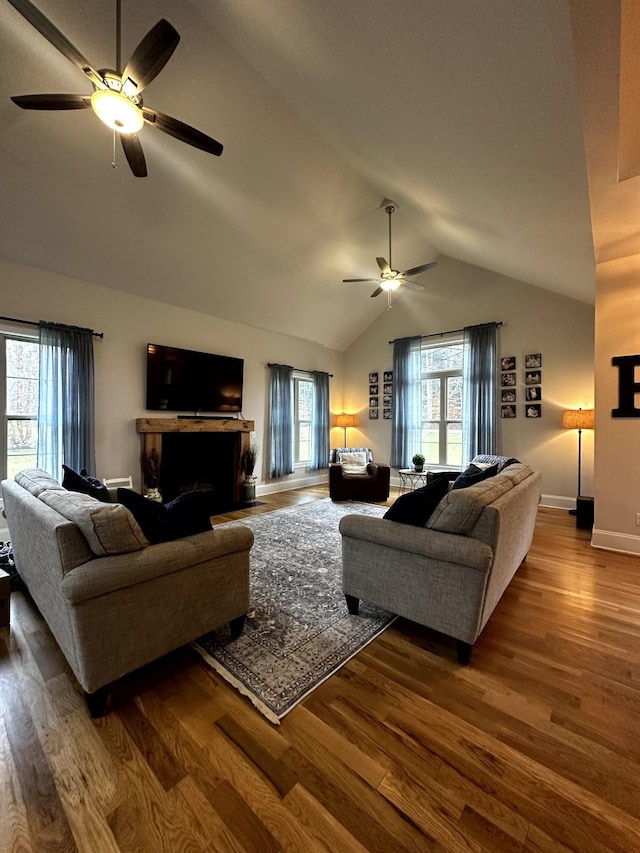 living room with vaulted ceiling, ceiling fan, and hardwood / wood-style floors