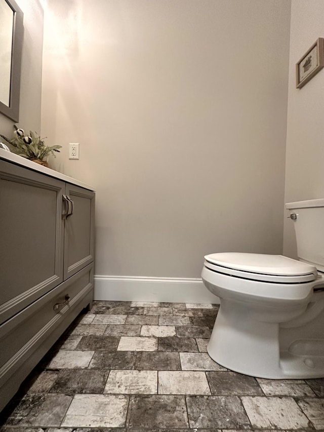 bathroom with toilet and vanity