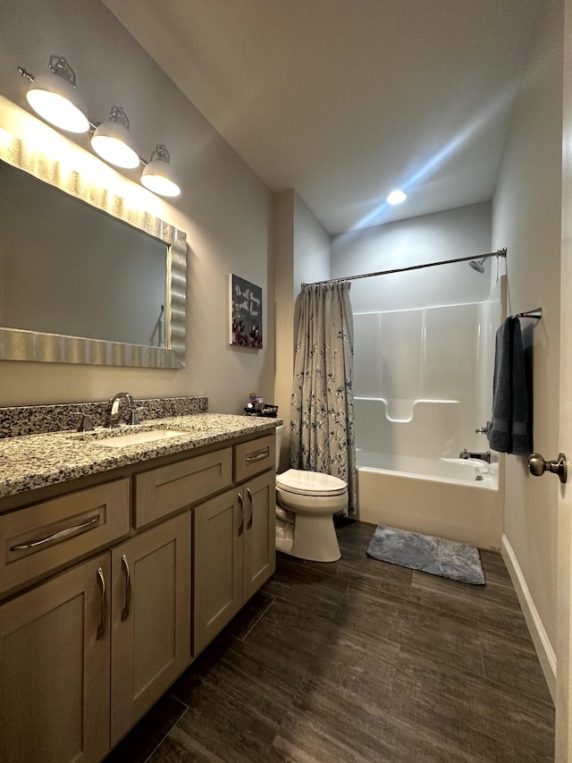 full bathroom with wood-type flooring, toilet, vanity, and shower / bath combo