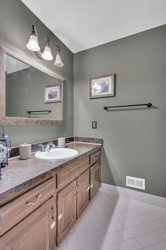 bathroom with tile patterned floors and vanity