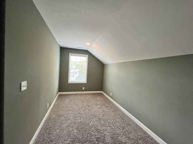 bonus room featuring carpet and lofted ceiling